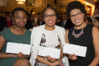 From left, Ayobami Fatunmbi, Danielle Dickson and LaVerne Thompson are all smiles as they excitedly anticipate the opening of their envelopes to reveal their residency placements on Match Day.