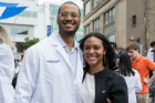Austin M. Price, a trainee in the internal medicine residency program, celebrates with fourth-year medical student Shanice Guerrier.