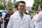 Kyungduk Rho, a trainee in the neurosurgery residency program, is all smiles at the Long White Coat Ceremony.