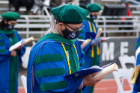 Jacobs School Class of 2021 member Phien Tang recites the Hippocratic Oath with his fellow graduates during the April 30 commencement ceremony. 