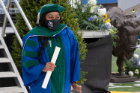 Karole T. Collier leaves the stage with her medical degree. She received multiple commencement-related awards, including the inaugural Dean’s Transformational Award. 