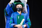 Chelsey Barton Reed is hooded as a graduate of the Jacobs School Class of 2021. She earned dual degrees — a medical degree and a doctoral degree in neuroscience.