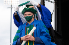 Marc Daniel Ruszaj is hooded as a graduate of the Jacobs School Class of 2021.