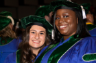 Leiah Nicole Ashton, left, and Shanique Carmellia Bailey are all smiles following the commencement ceremony.