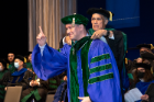Ryan A. Razek’s direction is pointing up after being hooded by Charles M. Severin, MD, PhD.