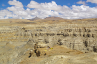 Aerial view of Liu and colleagues at the fossil locality, where she made the discovery on the Tibetan Plateau. The hilly formations in the background are the Zanda Earth Forest. 