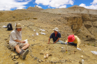 Liu, far right, and colleagues Gary Takeuchi, center, and Jack Tseng, PhD, working in the field in the newly discovered site in Zanda Basin.