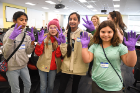Getting accustomed to their purple gloves are Troop #306 members (from left) Norah Altamimi, Caroline Keim (in pink hat), Chand Kodial and Izabelle Tucholski. 