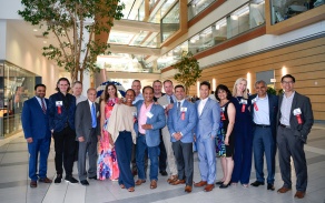 Large group standing in the atrium. 