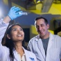 Researchers looking at a slide. 