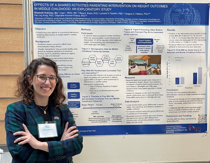 Elizabeth Kubiniec stands by her poster on UB Research Day 2025. 