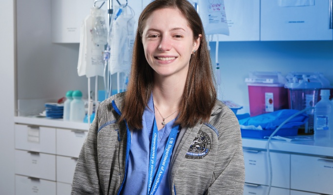 Dr. Applegate, a resident, is in a clinical setting. 