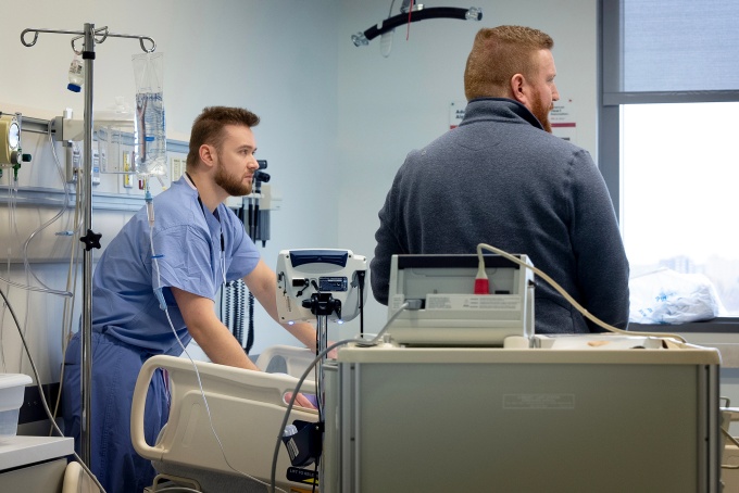 Boris Borovcanin and Logan Cooney in simulation lab. 