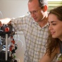 Photo of Mark Sutton and student at work in his lab. 