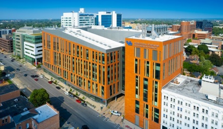 Aerial image of the exterior of the Medical School Building, home of the Jacobs School of Medicine and Biomedical Sciences, in downtown Buffalo, NY photographed in August 2021. Photographer: Douglas Levere. 
