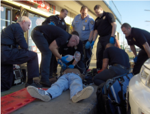 EMS providers assist a patient. 