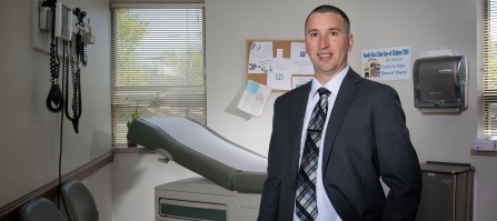 Robert W. Macek, MD, in an exam room.
