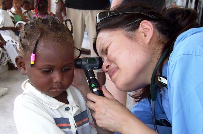 A doctor examines a patient. 