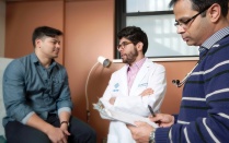 Faculty members with a patient. 