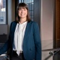 Rebekah J. Walker, PhD, stands near a window. 