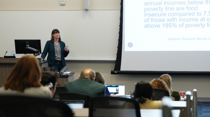 Dr. Walker speaks before an audience.