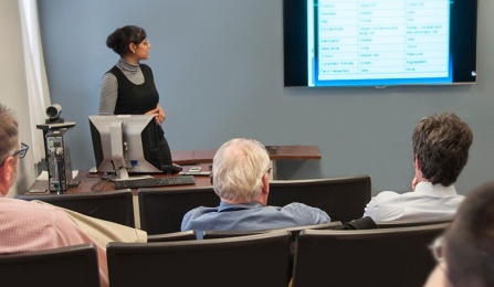 Sandhya Shukla, MD, presenting a slide at grand rounds. 