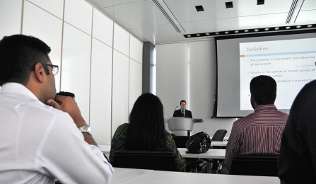 Philippe E. Jaoude, MD, leads a conference.