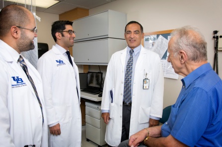 Sanjay Sethi, MD, sees a patient with Ravi Savani, MD, and Mohamed Gashouta, MD.