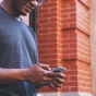 A person dials on a phone. 