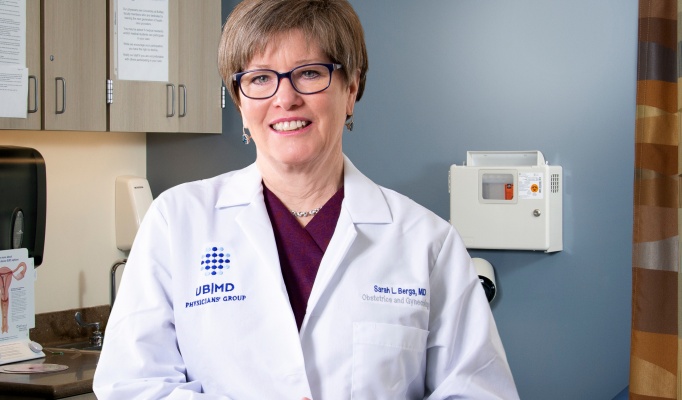 Dr. Berga is in a clinical setting. 