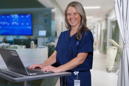 Jennifer Gurske-dePerio, MD in a clinical setting.