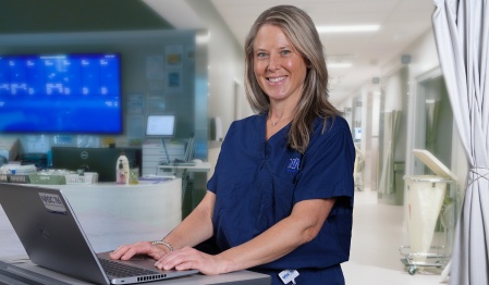 Jennifer Gurske-dePerio, MD in a clinical setting. 