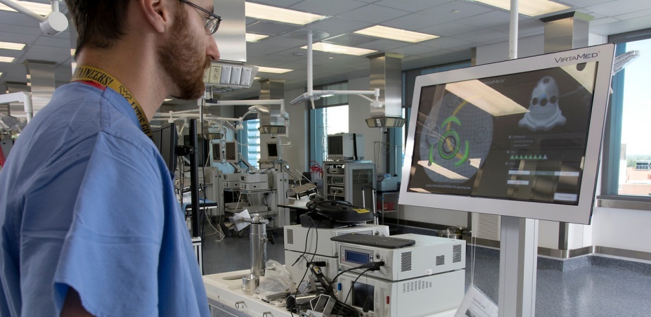 A lab technician uses lab equipment. 