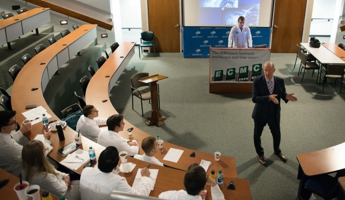 Trainees attend a lecture.