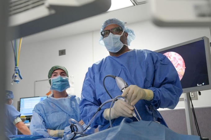 Chair and resident in the operating room. 