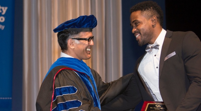 Kerri Damion Pryce, PhD ’18, receives the Dennis Higgins Award for PhD Dissertation Research in Pharmacology and Toxicology from his mentor, Arin Bhattacharjee, PhD. 