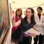 Group of medical students looking at a painting in an art gallery. 
