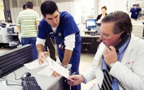 Medical resident consulting with a faculty member in a hospital. 
