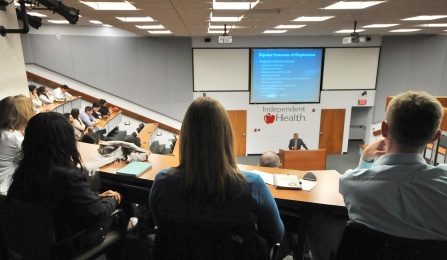 Residents listening to a lecture at the twice annual Pharmaceutical Symposium. 