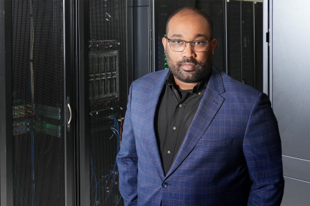 Jamal B. Williams, PhD, is near IT equipment.