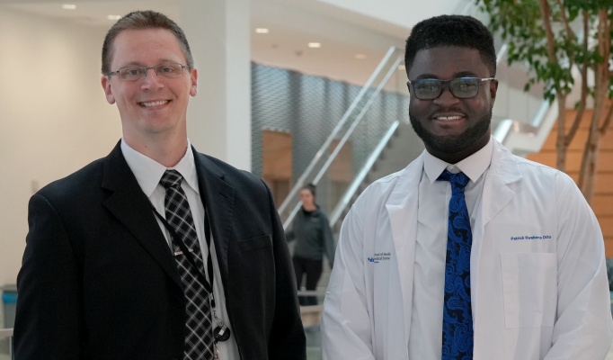 Dr. Grant with student Patrick Oduro. 