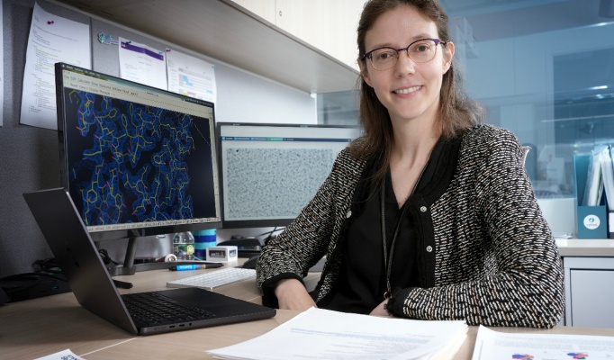 Dr. Pillon is at her desk. 