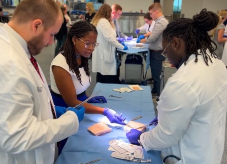 Surgery residents working on a skills lab. 