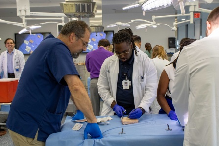 Dr. Posner leading a suture lab for surgery residents. 