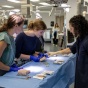 Alison Pletch, MD, leading a suturing lab with surgery residents. 