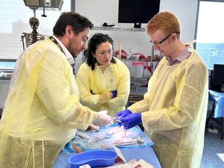 Three residents in skills lab. 
