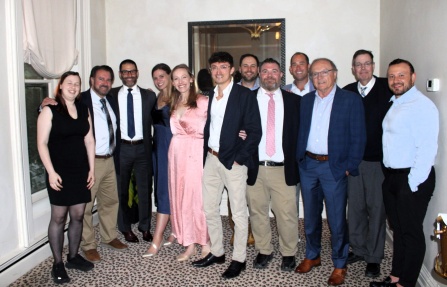 Group of residents at an event in dress clothes.