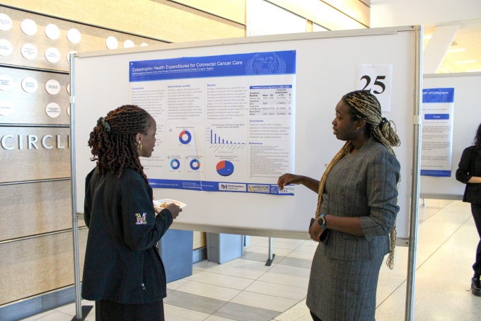 Surgical resident, Frankie Uwechue, MD, giving a poster presentation at the 20th Annual Research Day. 