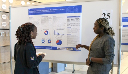Surgical resident, Frankie Uwechue, MD, giving a poster presentation at the 20th Annual Research Day. 