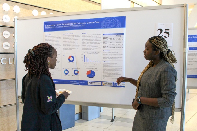 Surgical resident, Frankie Uwechue, MD, giving a poster presentation at the 20th Annual Research Day. 